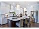 Gourmet kitchen with white cabinets and quartz countertops at 2865 Silk Hope Gum Springs Rd, Pittsboro, NC 27312