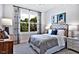 Cozy bedroom with large window and stylish decor at 2865 Silk Hope Gum Springs Rd, Pittsboro, NC 27312