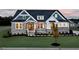Two-story home with stone and siding exterior at 2865 Silk Hope Gum Springs Rd, Pittsboro, NC 27312