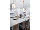 Modern kitchen with island, white cabinets, and gold accents at 2865 Silk Hope Gum Springs Rd, Pittsboro, NC 27312