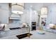 Modern kitchen with white cabinets, quartz countertops, and gold fixtures at 2865 Silk Hope Gum Springs Rd, Pittsboro, NC 27312