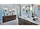 Modern bathroom with double vanity and large mirror at 2865 Silk Hope Gum Springs Rd, Pittsboro, NC 27312