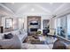 Spacious living area with fireplace and access to patio at 2865 Silk Hope Gum Springs Rd, Pittsboro, NC 27312