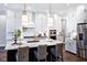 Modern kitchen with large island and stainless steel appliances at 2865 Silk Hope Gum Springs Rd, Pittsboro, NC 27312