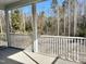 Screened porch overlooking wooded area at 160 Emerson Fields Dr, Pikeville, NC 27863