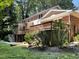 House exterior with a large deck and landscaped yard at 4808 Connell Dr, Raleigh, NC 27612