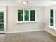 Bright bedroom with a large window and neutral walls at 4808 Connell Dr, Raleigh, NC 27612