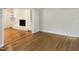 Living room with hardwood floors and a brick fireplace at 4808 Connell Dr, Raleigh, NC 27612
