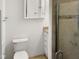 Updated bathroom with granite countertop and a glass shower at 4808 Connell Dr, Raleigh, NC 27612