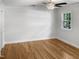 Bright bedroom featuring hardwood floors and ample natural light at 4808 Connell Dr, Raleigh, NC 27612