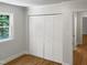 Bedroom with built-in closet and hardwood floors at 4808 Connell Dr, Raleigh, NC 27612