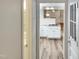 View into a bright kitchen with white cabinets and granite countertops at 4808 Connell Dr, Raleigh, NC 27612