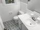 Stylish bathroom with black and white patterned floor tiles at 4808 Connell Dr, Raleigh, NC 27612