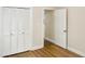 Bedroom with closet and hardwood floors at 4808 Connell Dr, Raleigh, NC 27612