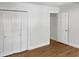 Bedroom with double doors leading to closet and hardwood floors at 4808 Connell Dr, Raleigh, NC 27612