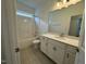 Clean bathroom, featuring a vanity with a quartz countertop, a bathtub, and toilet at 146 Swain St, Clayton, NC 27527