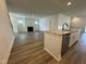 Open concept kitchen with island, granite countertops, and stainless steel appliances at 146 Swain St, Clayton, NC 27527