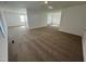 Large bonus room carpeted throughout with multiple windows at 146 Swain St, Clayton, NC 27527