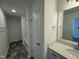 Clean bathroom with vanity, a tub and grey tile flooring at 146 Swain St, Clayton, NC 27527