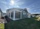 Covered back porch with green siding and access to backyard at 146 Swain St, Clayton, NC 27527