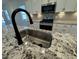Modern kitchen island with granite countertop and stainless steel appliances at 146 Swain St, Clayton, NC 27527