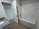 Bathroom with shower/tub combo and granite vanity at 231 Lotus Ave, Smithfield, NC 27577