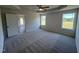 Spacious bedroom with carpet, ceiling fan, and access to backyard at 231 Lotus Ave, Smithfield, NC 27577