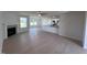Open living room with kitchen island and fireplace at 231 Lotus Ave, Smithfield, NC 27577