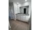 Double vanity bathroom with granite countertop and ample storage at 231 Lotus Ave, Smithfield, NC 27577