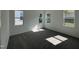Bright bedroom featuring ample natural light and plush carpeting at 177 Swain St, Clayton, NC 27527