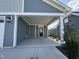 Covered porch with access to front door and garage at 177 Swain St, Clayton, NC 27527