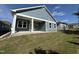 Gray house with covered patio and grassy backyard at 177 Swain St, Clayton, NC 27527