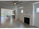 Open living room with hardwood floors, fireplace and kitchen views at 177 Swain St, Clayton, NC 27527