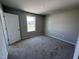 Well-lit bedroom with neutral carpeting at 218 Lotus Ave, Smithfield, NC 27577
