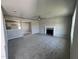 Open living room with view into kitchen and fireplace at 218 Lotus Ave, Smithfield, NC 27577
