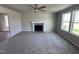 Living room with fireplace, ceiling fan, and hardwood floors at 218 Lotus Ave, Smithfield, NC 27577