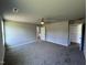 Large main bedroom with gray walls, carpet flooring, and access to a bath at 138 Lotus Ave, Smithfield, NC 27577