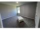 Spacious bedroom with plush carpeting and a window with natural light at 138 Lotus Ave, Smithfield, NC 27577