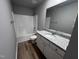 Clean bathroom with a shower/tub combo and granite vanity at 138 Lotus Ave, Smithfield, NC 27577