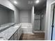 Main bathroom with granite countertop, a soaking tub, and a shower at 138 Lotus Ave, Smithfield, NC 27577