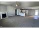 Open concept living room with kitchen and breakfast area views at 138 Lotus Ave, Smithfield, NC 27577