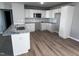Modern kitchen with white cabinets, granite counters, and tile backsplash at 138 Lotus Ave, Smithfield, NC 27577