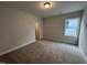 Bedroom with carpet, neutral walls, and window at 808 Challenger Ln, Knightdale, NC 27545