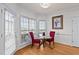Charming breakfast nook with glass-top table and red chairs at 19 Silverside Dr, Angier, NC 27501