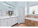 Bathroom features a double vanity, soaking tub, and a separate shower at 19 Silverside Dr, Angier, NC 27501
