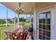 Relaxing screened porch with wicker furniture at 19 Silverside Dr, Angier, NC 27501