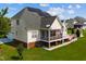 House exterior with solar panels, screened porch, and deck at 19 Silverside Dr, Angier, NC 27501