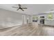 Modern kitchen with white cabinets, stainless steel appliances, and vinyl plank flooring at 104 Twain Dr, Garner, NC 27529