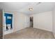 View of a bedroom with ensuite bathroom access and a stairway to another level at 3614 Lion Ridge Ct, Raleigh, NC 27612