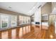 Living room with fireplace, built-in shelves, hardwood floors, high ceilings, and large windows at 3614 Lion Ridge Ct, Raleigh, NC 27612